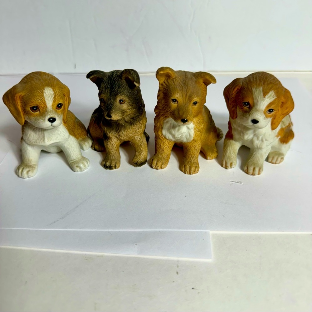Vintage Homco set of 4 dogs. Four adorable ceramic dog figurines from Homco.